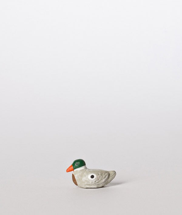 Santon le canard couché gris